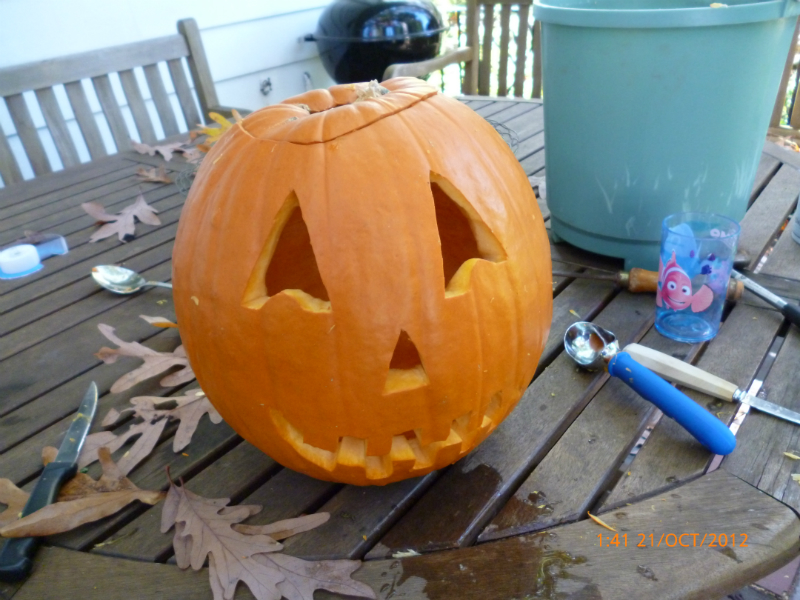 The pumpkin carving of the Jack-O-Lantern design is completed